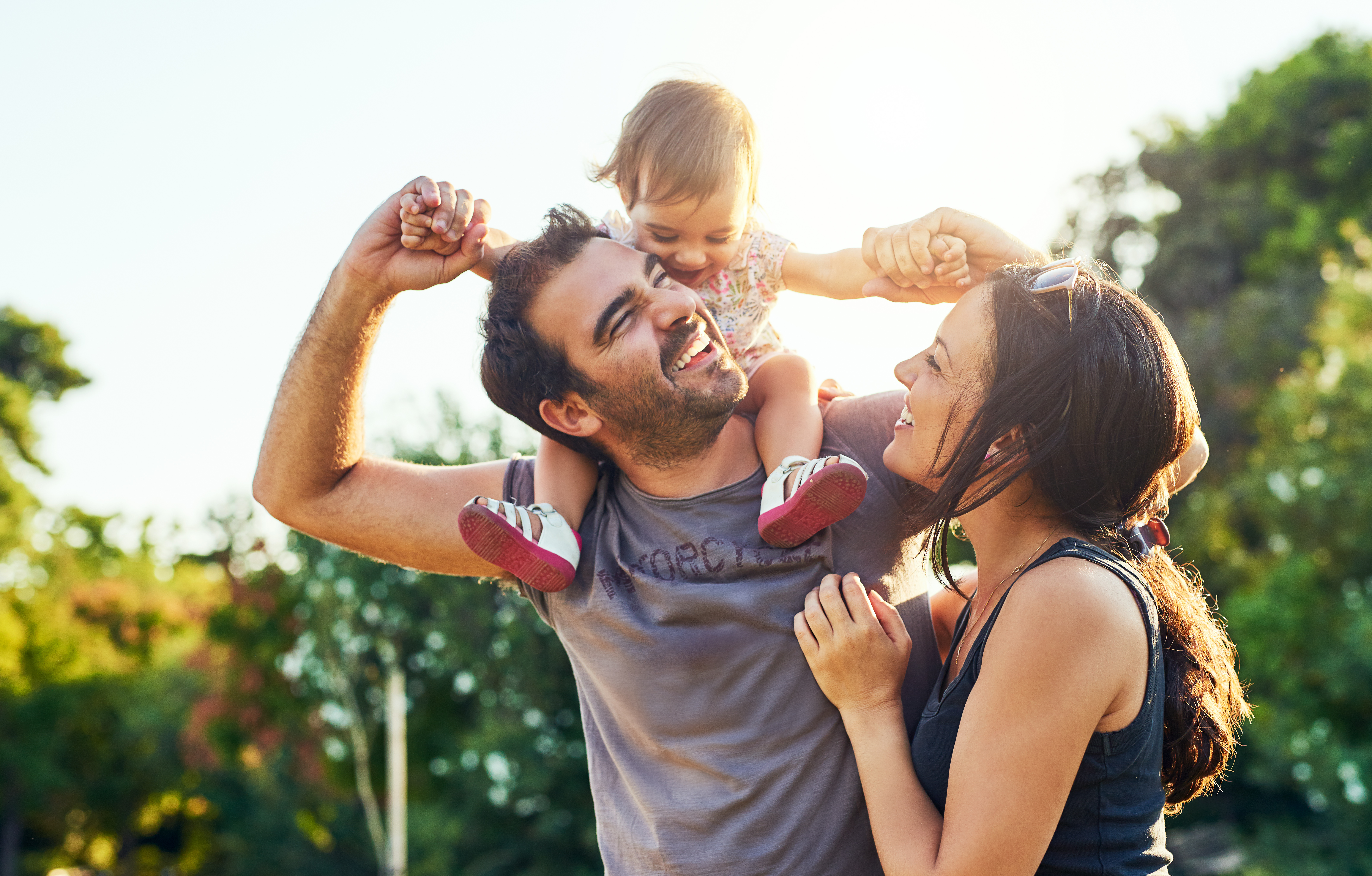 Parents with a young child outdoors